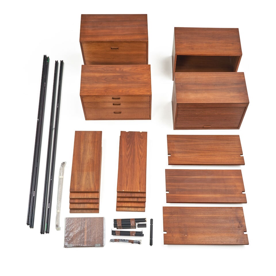 GEORGE NELSON (1908-1986) FOR STRUCTURAL PRODUCTS 'OMNI UNIVERSAL SPACE-MAKER SYSTEM' Charlotte,...: GEORGE NELSON (1908-1986) FOR STRUCTURAL PRODUCTS 'OMNI UNIVERSAL SPACE-MAKER SYSTEM' Charlotte, Michigan, circa 1960, walnut veneer, walnut, aluminum, laminate, unmarked, parts for a three-bay config