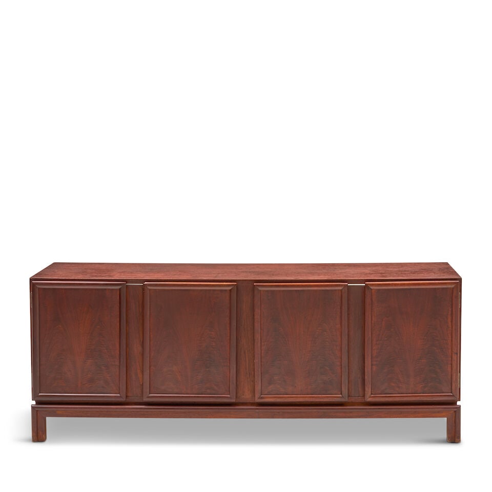 MID-CENTURY MODERN CREDENZA circa 1960, walnut, unmarked, two doors open to interiors designed f...: MID-CENTURY MODERN CREDENZA circa 1960, walnut, unmarked, two doors open to interiors designed for adjustable shelves, lacks back board, ht. 22 1/2, wd. 57, dp. 16 3/4 in. This lot is subject to the f