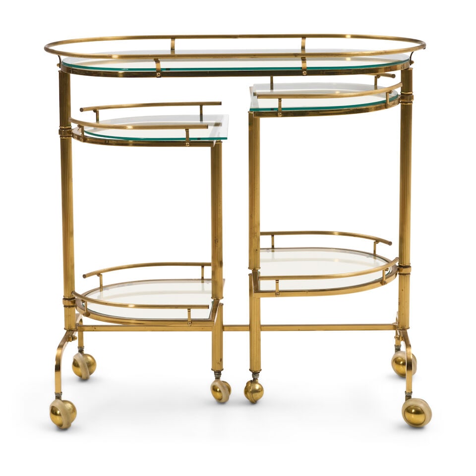 HOLLYWOOD REGENCY DRINKS TROLLEY United States, circa 1960, lacquered brass, glass, Shepherd bal... (1 of 2)