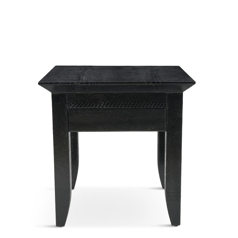 KARL SPRINGER (1931-1991) 'BRISTOL' SIDE TABLE New York, circa 1985, wood, snakeskin, single dra...: KARL SPRINGER (1931-1991) 'BRISTOL' SIDE TABLE New York, circa 1985, wood, snakeskin, single drawer, metal maker's label with facsimile signature, ht. 24 1/2, wd. 24, dp. 24 in. Footnotes: Provenance 