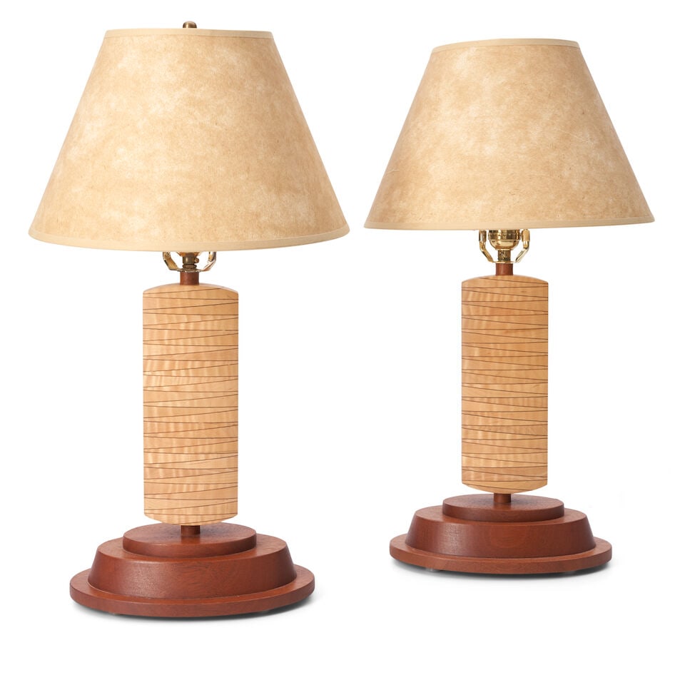PAIR OF STUDIO FURNITURE TABLE LAMPS United States, dated 2009, walnut, laminated curly maple, s...: PAIR OF STUDIO FURNITURE TABLE LAMPS United States, dated 2009, walnut, laminated curly maple, single three-way sockets, incised marks 'MD 2009,' additional pair of brass finials, paper shades, base h