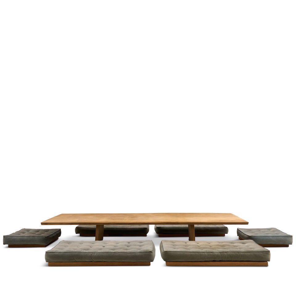 NIELS SCHOENFELDER (20TH/21ST CENTURY) LOW TABLE AND SEATING early 21st century, table, teak sla...: NIELS SCHOENFELDER (20TH/21ST CENTURY) LOW TABLE AND SEATING early 21st century, table, teak slab on slab legs, unmarked, ht. 16, wd. 118, dp. 40, cushion seating set on wood bases, four ht. 7, wd. 50