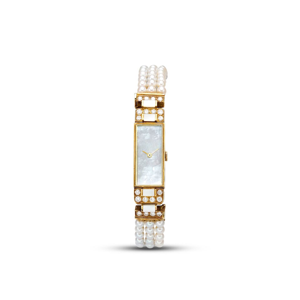 VAN CLEEF & ARPELS | A YELLOW GOLD, CULTURED PEARL AND DIAMOND-SET BRACELET WATCH WITH MOTHER-OF: VAN CLEEF & ARPELS | A YELLOW GOLD, CULTURED PEARL AND DIAMOND-SET BRACELET WATCH WITH MOTHER-OF-PEARL DIAL, CIRCA 1990 Case No: V2101 V19 Calibre: Quartz, signed Dial: Mother-of-pearl, signed