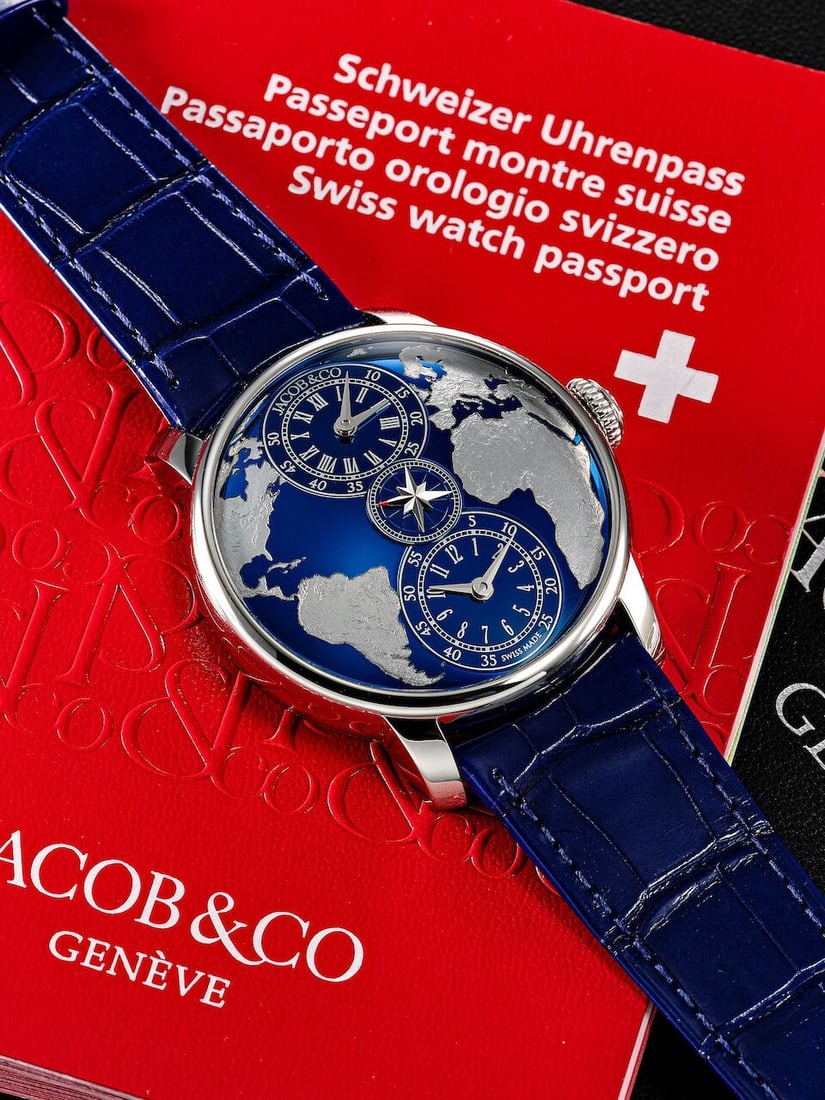 JACOB & CO | THE WORLD IS YOURS DUAL TIME, REF.DT100.10.AA.AA.A, A BRAND NEW STAINLESS STEEL DUA: JACOB & CO | THE WORLD IS YOURS DUAL TIME, REF.DT100.10.AA.AA.A, A BRAND NEW STAINLESS STEEL DUAL TIME ZONE WRISTWATCH, CIRCA 2026 Case No: 103580 Calibre: JCAA11, automatic, signed Dial: Blue,