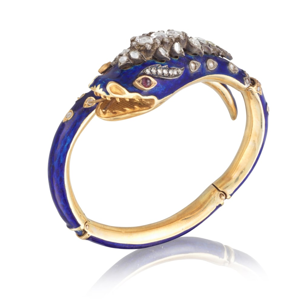 BRACELET 'SERPENT' ÉMAIL, RUBIS ET DIAMANTS, MILIEU DU 19E SIÈCLE: BRACELET 'SERPENT' ÉMAIL, RUBIS ET DIAMANTS, MILIEU DU 19E SIÈCLE Le bracelet articulé formant un serpent stylisé en émail bleu roi, accentué de diamants de taille rose e