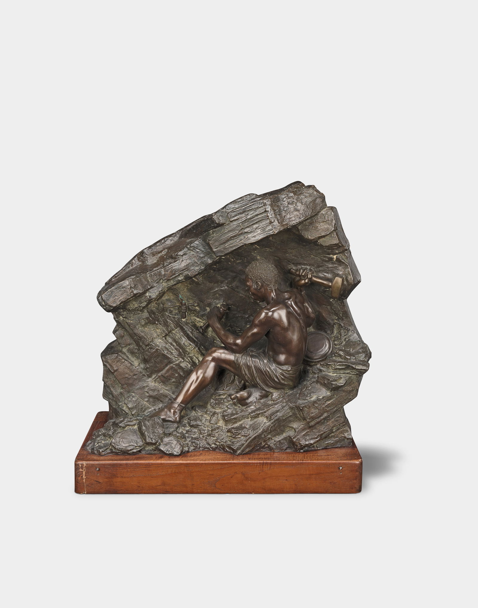 Anton van Wouw (South African, 1862-1945) The Hammer Worker: Anton van Wouw (South African, 1862-1945) The Hammer Worker signed and dated 'A van Wouw/ 1911 Joh-burg' (lower right) and inscribed 'Foundry-G. Massa. Rome.' (verso) bronze 60.5 x 66 x 24cm (23 13/16