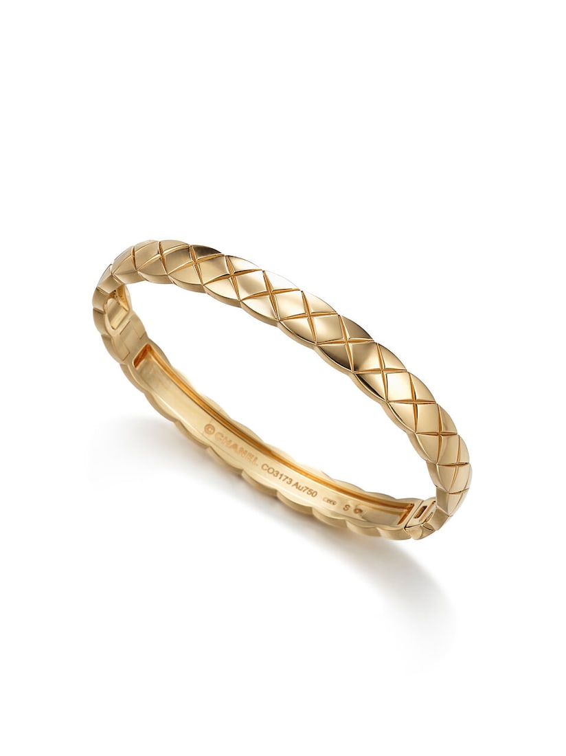 CHANEL: GOLD 'COCO CRUSH' BANGLE: CHANEL: GOLD 'COCO CRUSH' BANGLE 香奈兒：黃金「Coco Crush」手鐲 Signature: Chanel, no. CO3173, French assay marks Accompaniment: signed