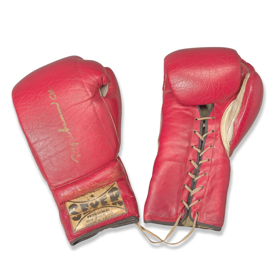 Muhammad Ali v Buster Mathis fight-worn signed gloves: Muhammad Ali v Buster Mathis fight-worn signed gloves Pair of boxing gloves worn by Muhammad Ali in his bout against Buster Mathis on 17 November 1971 at the Astrodome, Houston, Texas Cleto Reyes Seye