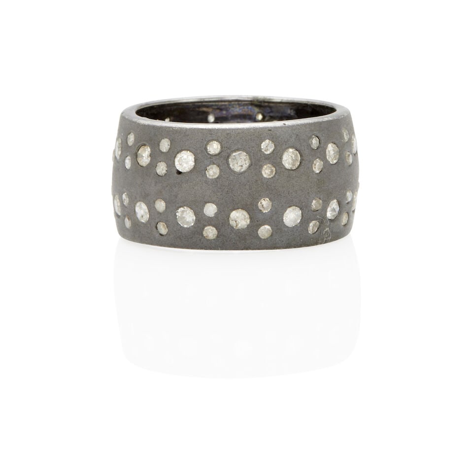 SILVER AND DIAMOND RING: SILVER AND DIAMOND RING • Silver • Numerous round single-cut diamonds weighing approximately 1.00 - 1.5 carat total • Size 6 3/4 • Estimated gross weight: 7.8