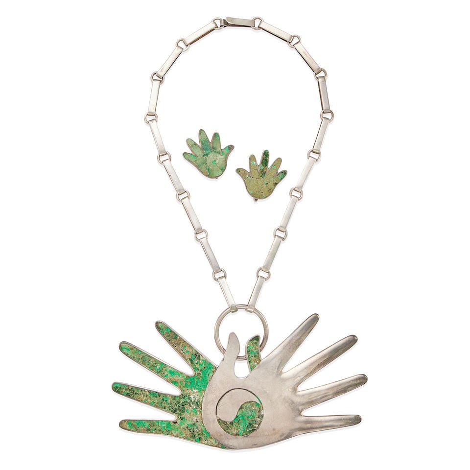 WILLIAM SPRATLING: SILVER AND GREEN HARDSTONE 'HANDS' NECKLACE AND EARRING SET: WILLIAM SPRATLING: SILVER AND GREEN HARDSTONE 'HANDS' NECKLACE AND EARRING SET • Silver 'Hands' pendant necklace with green hardstone inlay, length 14 ½ in • Pair of silver 'Hands'