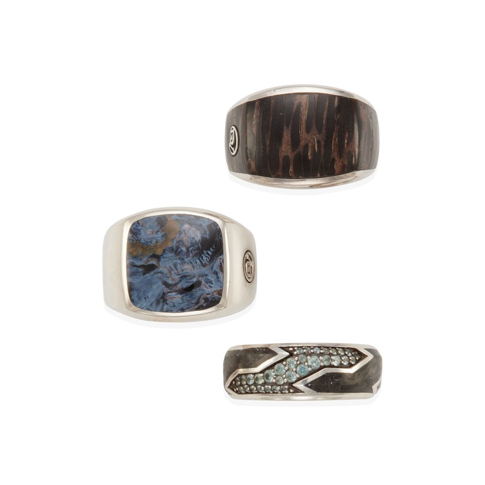 DAVID YURMAN: GROUP OF SILVER RINGS: DAVID YURMAN: GROUP OF SILVER RINGS • One ring of sterling silver with craved pietersite chalcedony center stone, signed D.Y., size 11 • One ring of sterling silver with wood center,