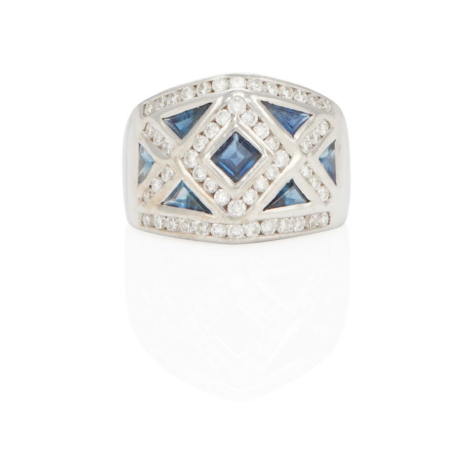 LE VIAN: 18K WHITE GOLD, SAPPHIRE, AND DIAMOND RING: LE VIAN: 18K WHITE GOLD, SAPPHIRE, AND DIAMOND RING • 18k white gold • 7 triangle shape sapphires weighing approximately 1.20 - 1.25 carats total • Numerous round diamonds weighing