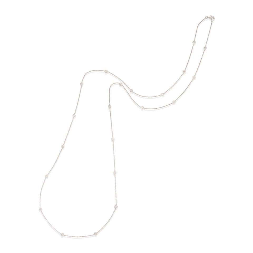 14K GOLD AND DIAMOND STATION NECKLACE: 14K GOLD AND DIAMOND STATION NECKLACE • 14k white gold • Numerous round diamonds weighing approximately 0.95 - 1.15 carat total • Length 36 in. • Estimated gross weight: 8.6