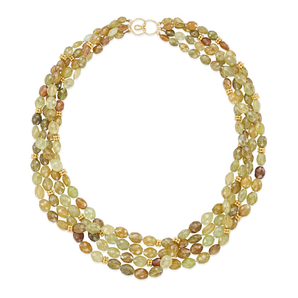 14K GOLD AND GARNET BEAD FOUR STRAND NECKLACE: 14K GOLD AND GARNET BEAD FOUR STRAND NECKLACE • 14k yellow gold • Numerous oval faceted grossular garnet beads measuring from 6.40 x 6.22 x 3.88 mm to 10.48 x 8.00 x 7.33 mm in diameter