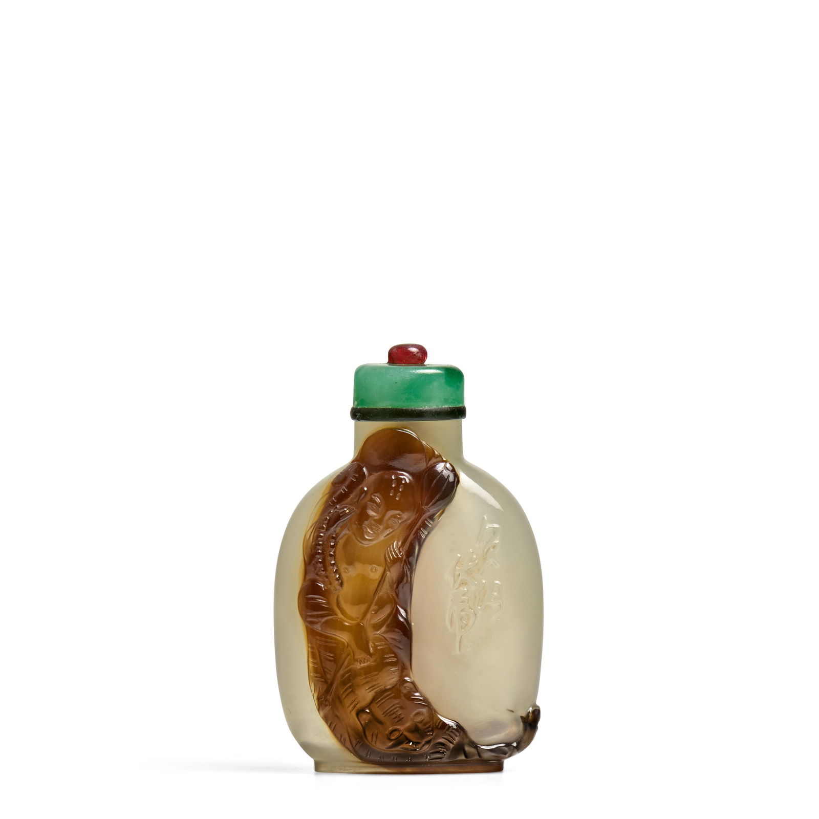 A SEMI-TRANSPARENT SHADOW AGATE 'FUHU LUOHAN' SNUFF BOTTLE 1780-1860, Official School: A SEMI-TRANSPARENT SHADOW AGATE 'FUHU LUOHAN' SNUFF BOTTLE 1780-1860, Official School Of rounded rectangular shape, a curling black-brown inclusion carved to one side with the Fuhu luohan seated on th