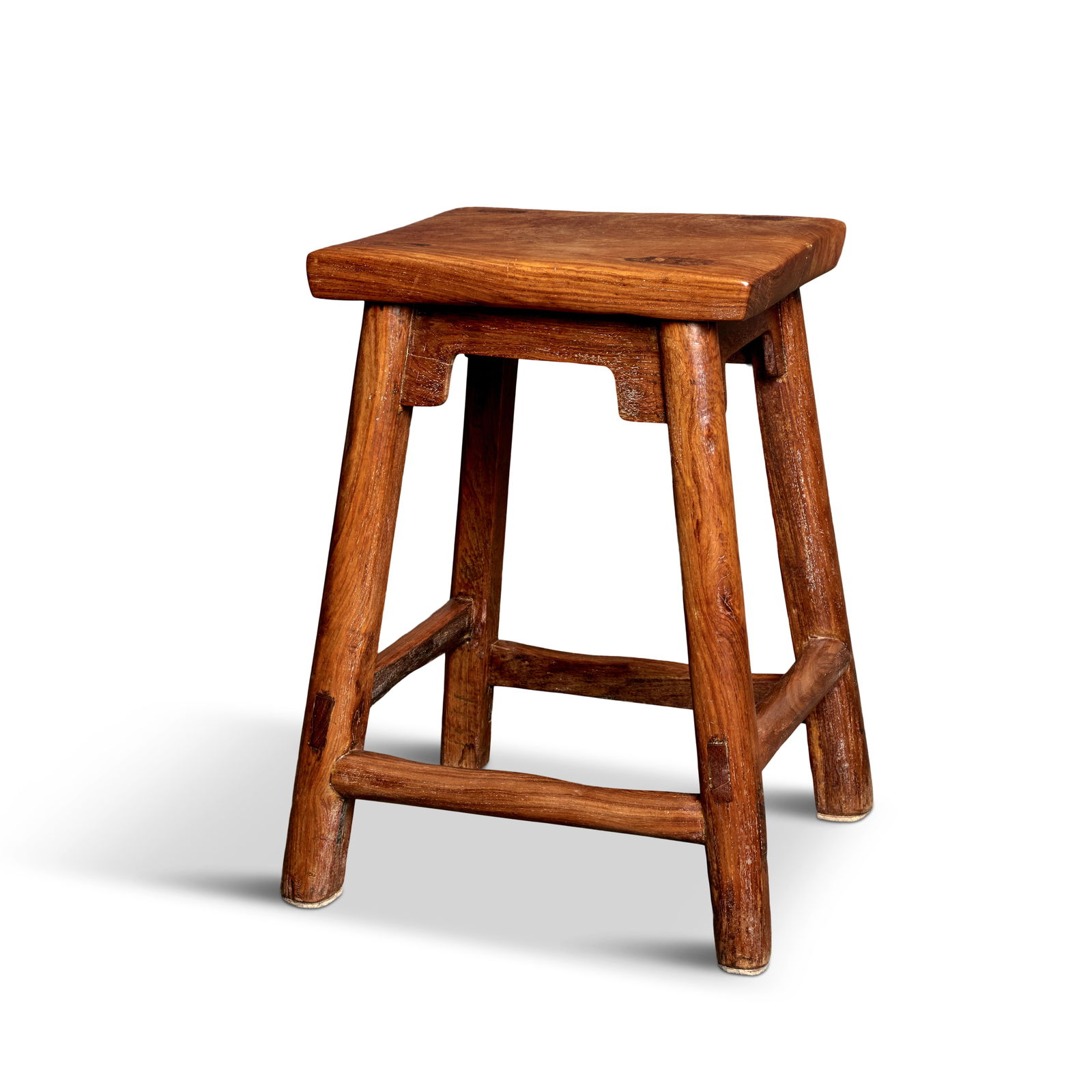 A RARE HUANGHUALI SQUARE STOOL, FANGDENG Ming Dynasty: A RARE HUANGHUALI SQUARE STOOL, FANGDENG Ming Dynasty The square top constructed from one thick piece of brilliantly figured huanghuali showing exposed tenons from the four flared oval supports flush