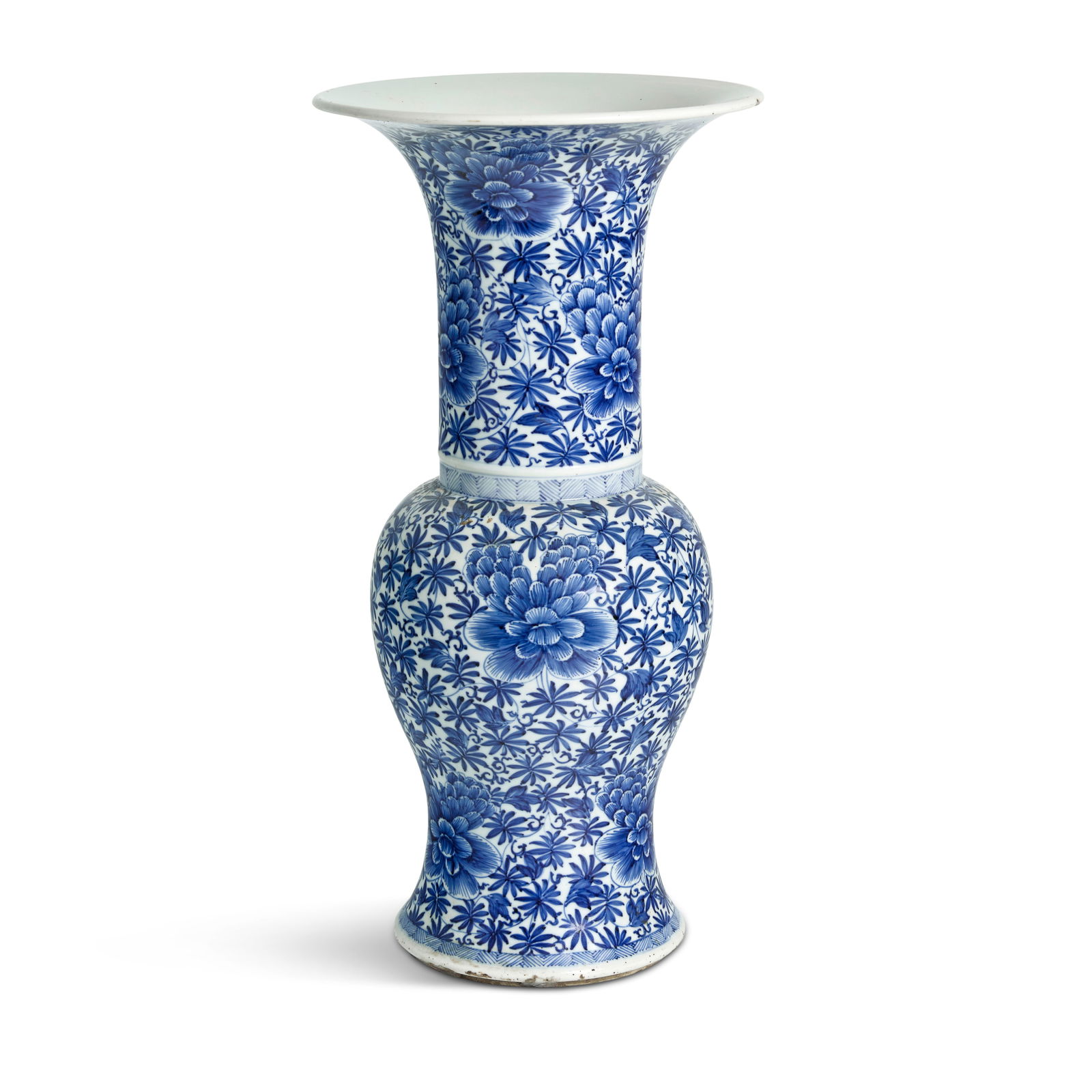 A BLUE AND WHITE 'PEONY' YEN YEN VASE Kangxi: A BLUE AND WHITE 'PEONY' YEN YEN VASE Kangxi Finely painted in brilliant shades of blue, the large flowerheads neatly arranged in four rows amidst dense leafy tendrils, a V-patterned border at the bot