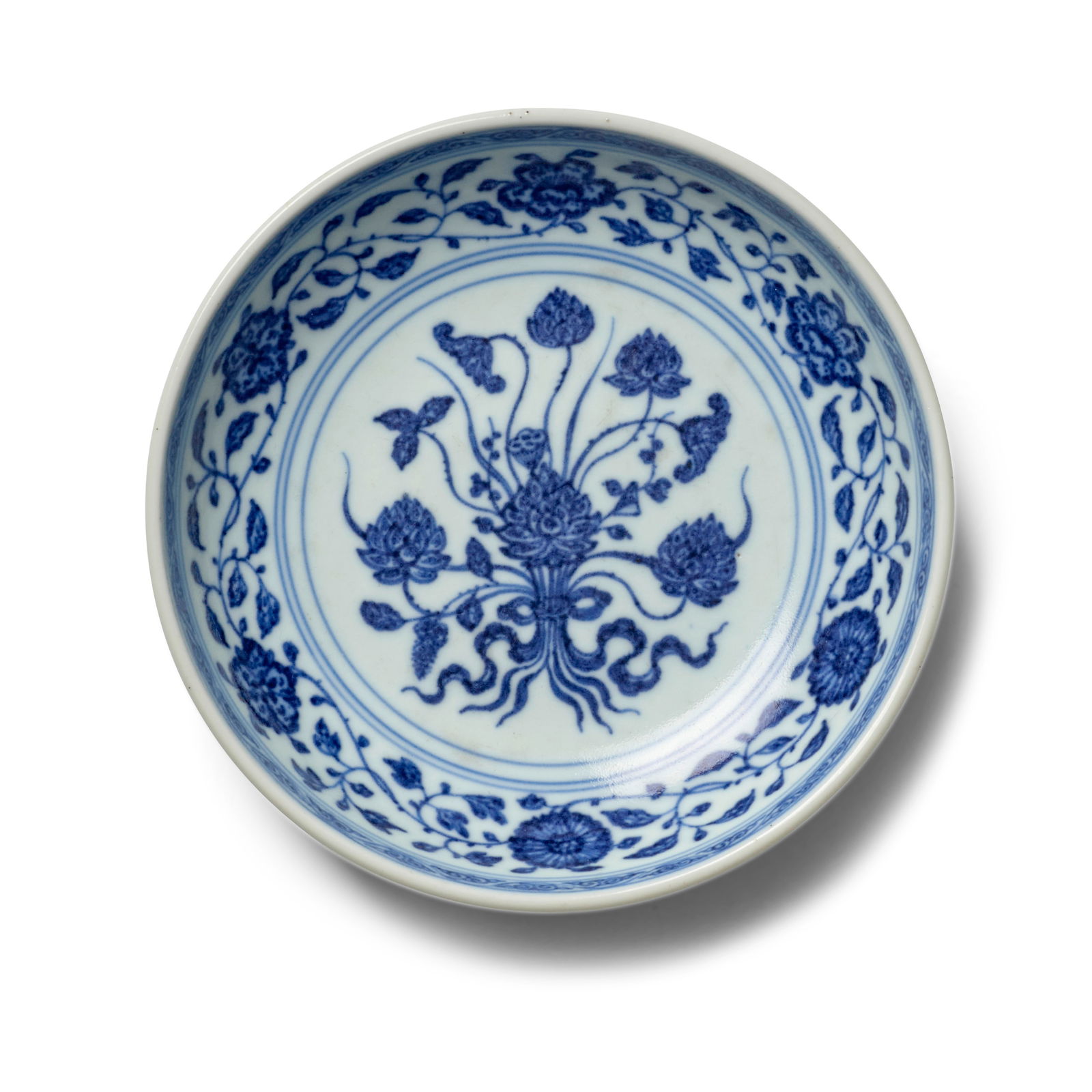 A SMALL MING-STYLE BLUE AND WHITE 'LOTUS BOUQUET' DISH Yongzheng six-character mark within doubl...: A SMALL MING-STYLE BLUE AND WHITE 'LOTUS BOUQUET' DISH Yongzheng six-character mark within double circles and of the period Following the Ming prototype and decorated in rich tones of cobalt simulatin