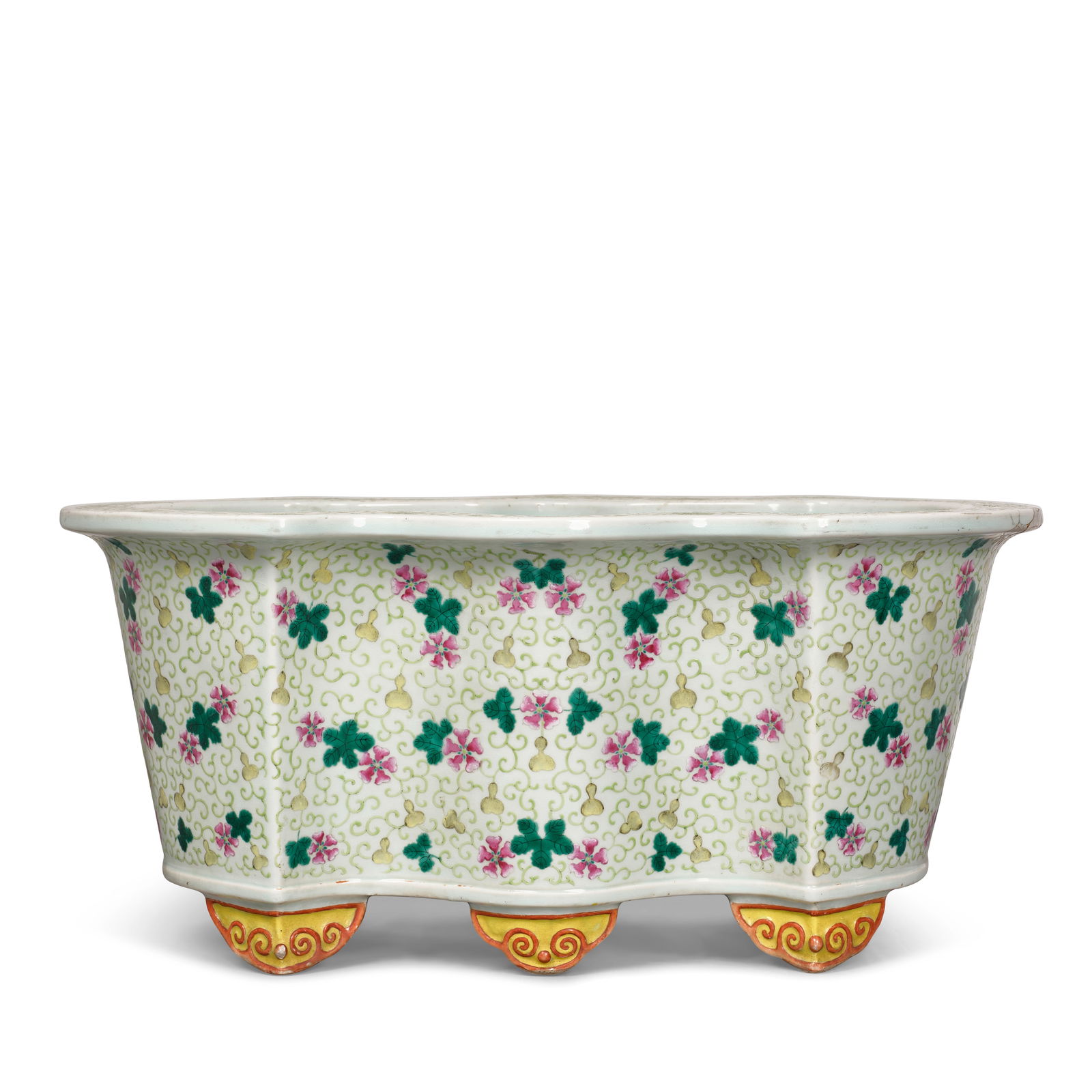 A FAMILLE-ROSE 'GOURD AND FLOWERHEAD' BASIN Guangxu period: A FAMILLE-ROSE 'GOURD AND FLOWERHEAD' BASIN Guangxu period Rested on six yellow-ground red-outlined ruyi-shaped feet, the basin sturdily potted with undulated rim, decorated to the flared rim and the