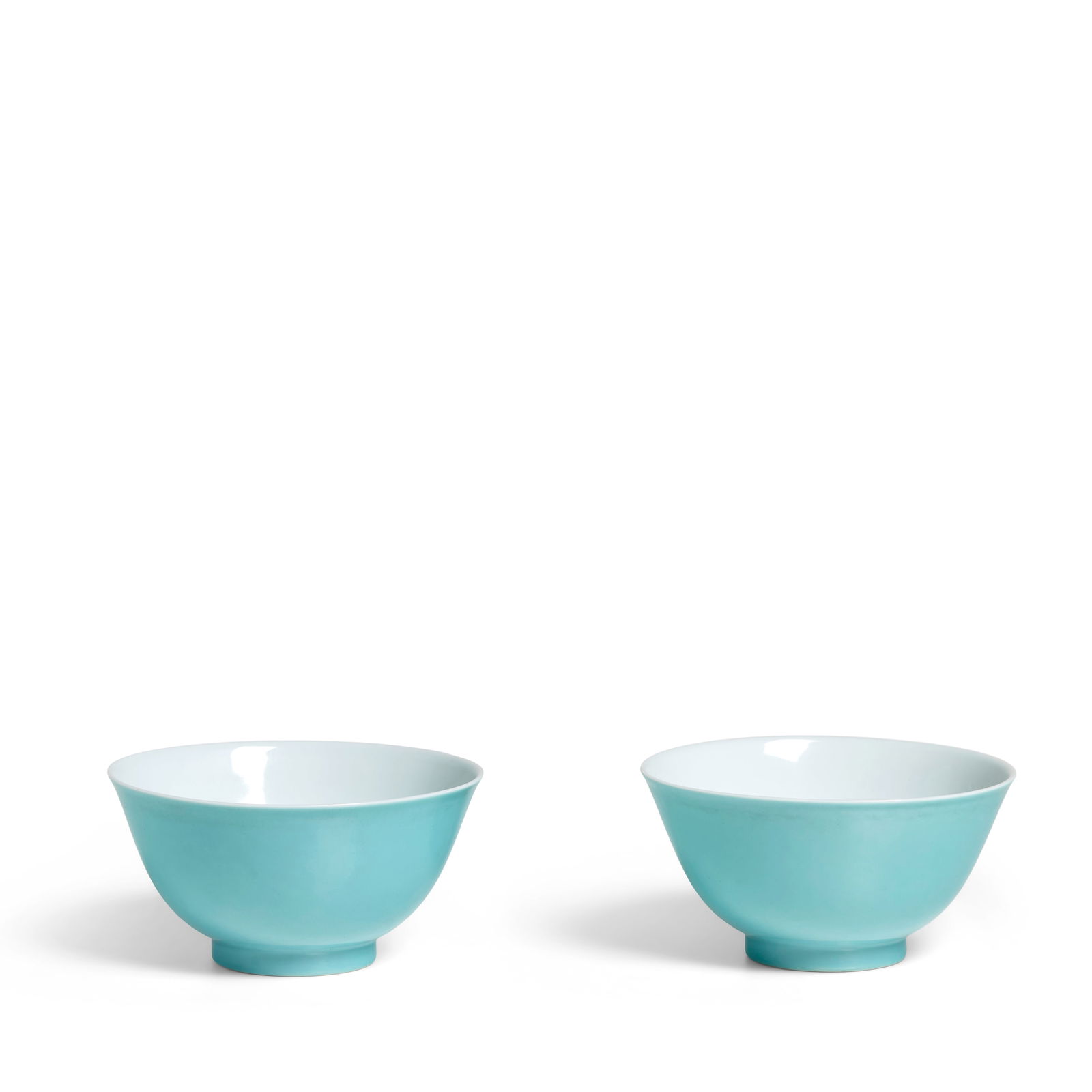 A RARE AND FINE PAIR OF SMALL TURQUOISE-GLAZED BOWLS Yongzheng six-character marks within double...: A RARE AND FINE PAIR OF SMALL TURQUOISE-GLAZED BOWLS Yongzheng six-character marks within double circles and of the period Delicately potted, each with deep rounded sides rising from a straight foot t