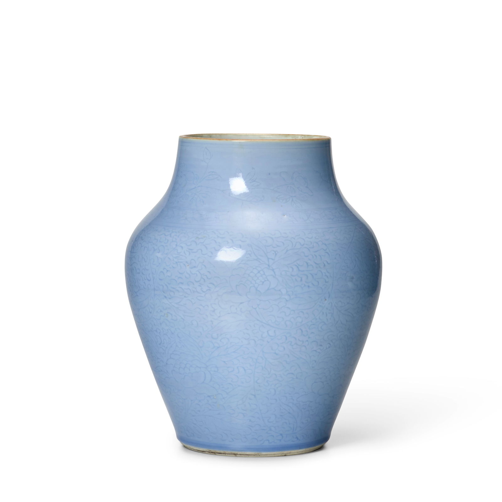AN INCISED LAVENDER-GLAZED VASE Shunzhi: AN INCISED LAVENDER-GLAZED VASE Shunzhi Of high-shouldered ovoid form, incised with large blossoming peony sprays beneath a narrow band of 'cracked ice' pattern, the short neck incised with a wider bo