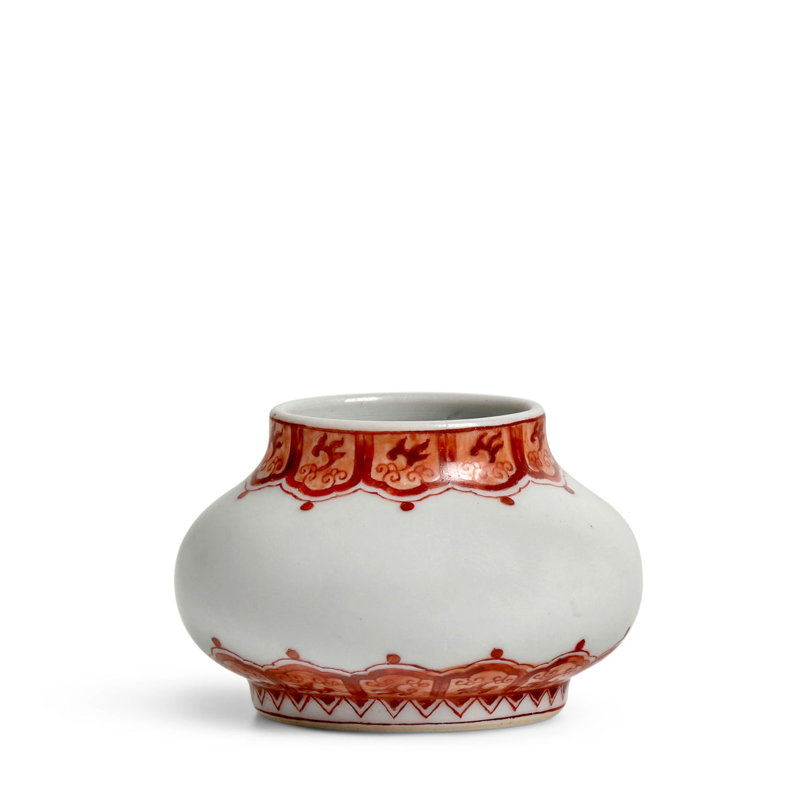 A RARE AND FINE IRON-RED-DECORATED WATER POT Yongzheng mark and of the period: A RARE AND FINE IRON-RED-DECORATED WATER POT Yongzheng mark and of the period Of compressed globular form, delicately painted with two iron-red lappet bands around the neck and above the foot accentin