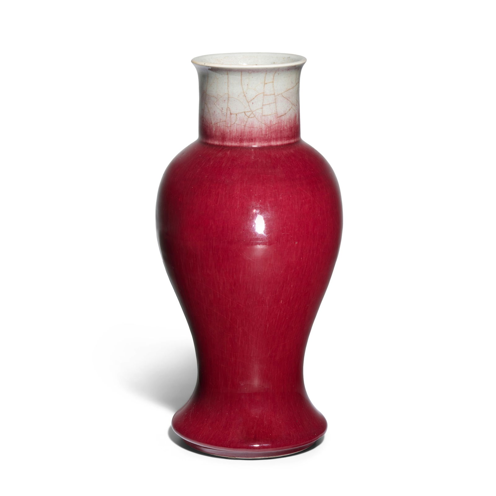 A LANGYAO BALUSTER VASE Kangxi: A LANGYAO BALUSTER VASE Kangxi The slender high-shouldered body surmounting a straight neck with everted rim, the splayed base supported on short ring foot, covered on the exterior with a brilliant ra