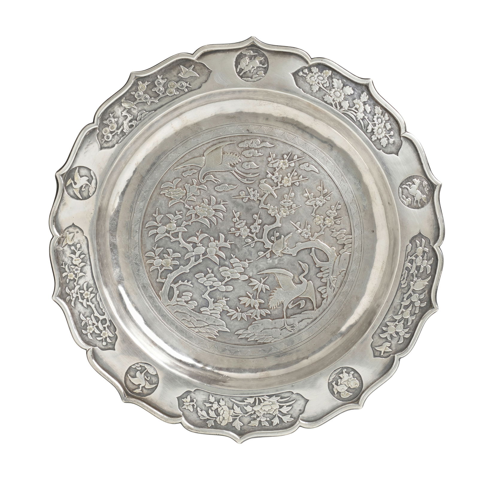 A DECAGONAL FOLIATE-RIM SILVER AND GILT SALVER WITH 'CRANES AND THE THREE FRIENDS OF WINTER' 18t...: A DECAGONAL FOLIATE-RIM SILVER AND GILT SALVER WITH 'CRANES AND THE THREE FRIENDS OF WINTER' 18th century, a mostly indecipherable engraved Arabic inscription to the reverse supported on four lobed-bu