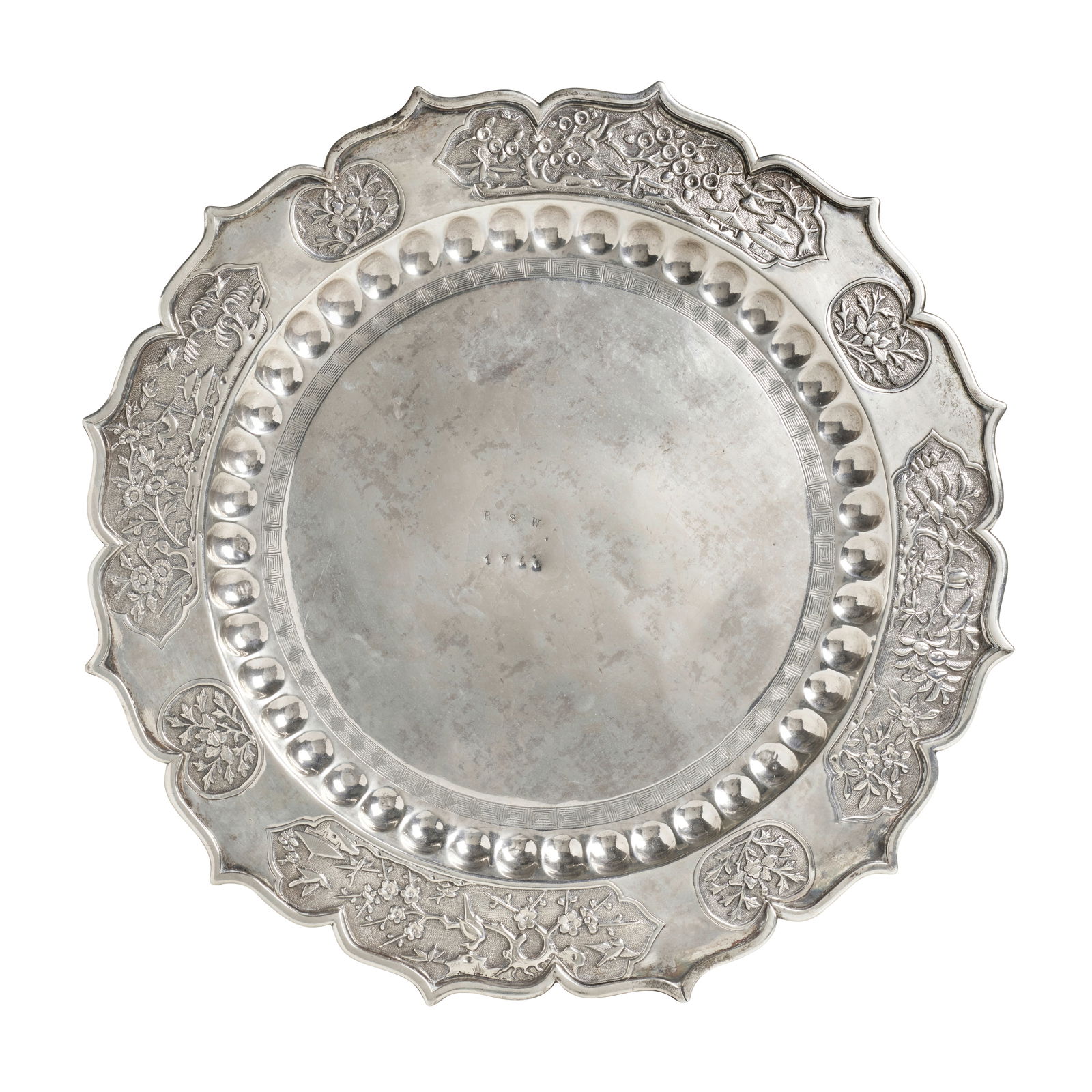 A DODECAGONAL FOLIATE-RIM 'FOUR-SEASONS' SILVER DISH 18th century, punch-stamped RSW, 1766: A DODECAGONAL FOLIATE-RIM 'FOUR-SEASONS' SILVER DISH 18th century, punch-stamped RSW, 1766 the dish with a slightly convex plain center with the punch-stamped initials and date, the cavetto with forty