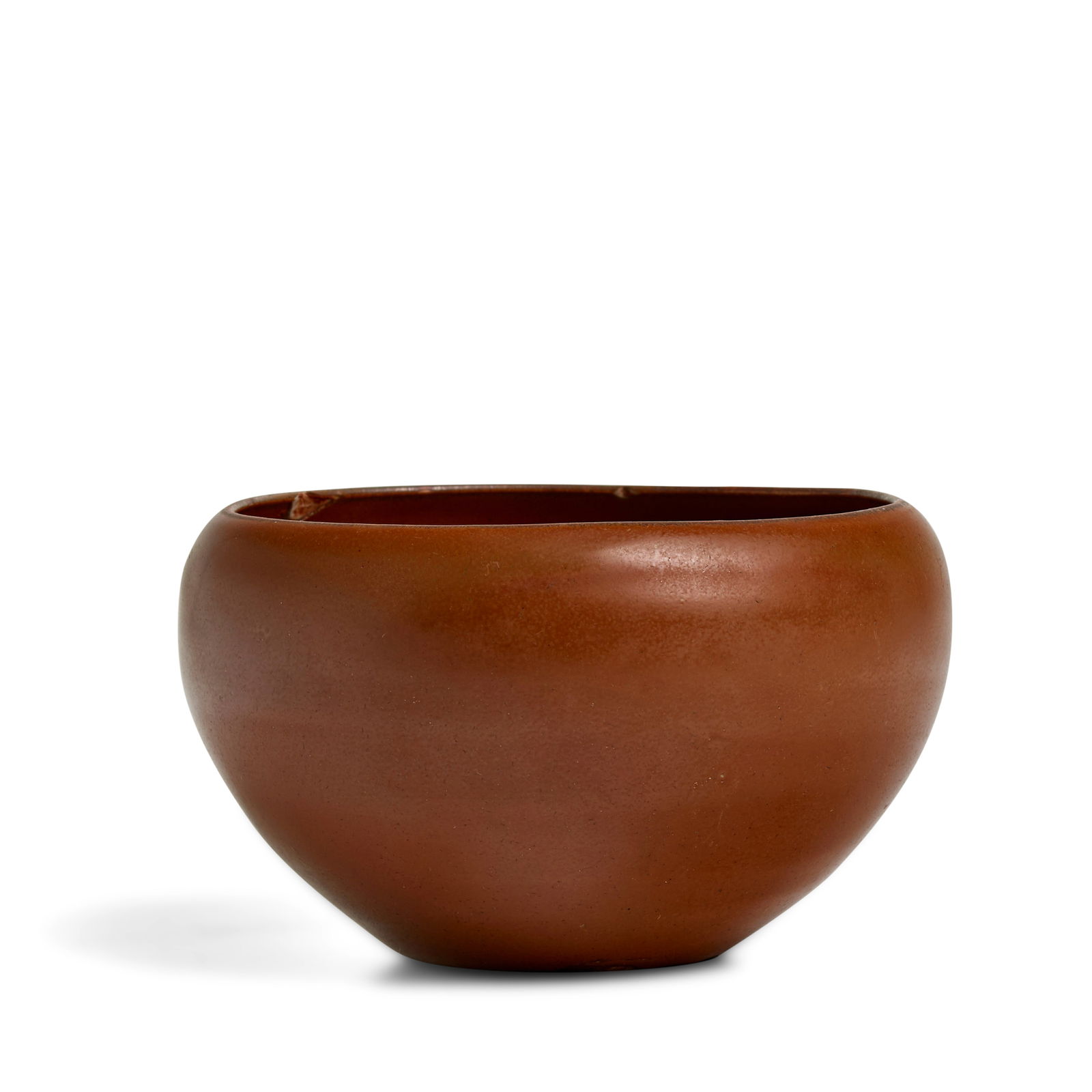 A SMALL DING-TYPE RUSSET-GLAZED ALMS BOWL Northern Song Dynasty: A SMALL DING-TYPE RUSSET-GLAZED ALMS BOWL Northern Song Dynasty The deeply rounded sides rising from the indented base, covered inside and out a smooth honey-brown glaze, the shallow foot and undersid
