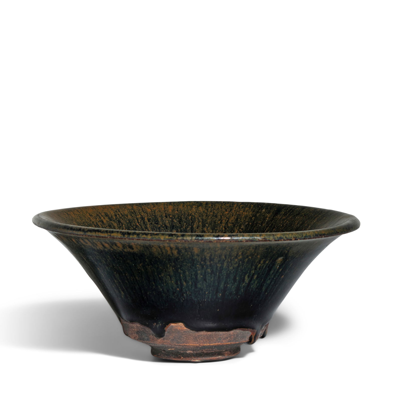 A LARGE CONICAL JIAN 'HARE'S FUR' BOWL Song Dynasty: A LARGE CONICAL JIAN 'HARE'S FUR' BOWL Song Dynasty Covered inside and out a thick black glaze with striated brown, stopping unevenly with 'teardrop' edges right before the angular base, all supported