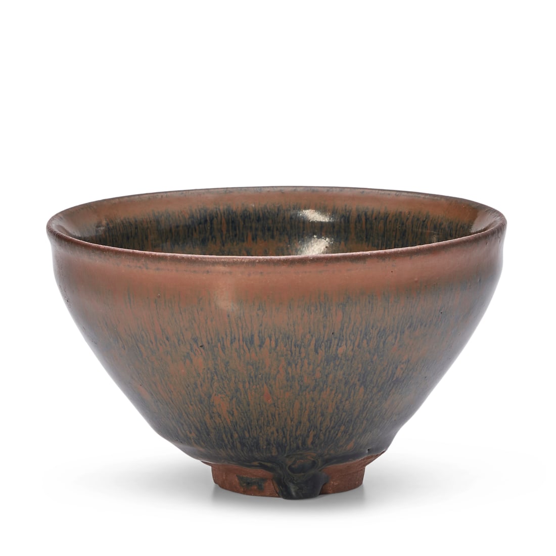 A JIAN 'HARE'S FUR' TEA BOWL Song Dynasty: A JIAN 'HARE'S FUR' TEA BOWL Song Dynasty Deeply rounded sides rising to a 'finger groove' rim, the interior and exterior covered with a lustrous black glaze with brown 'hare's fur' streaks thinning a