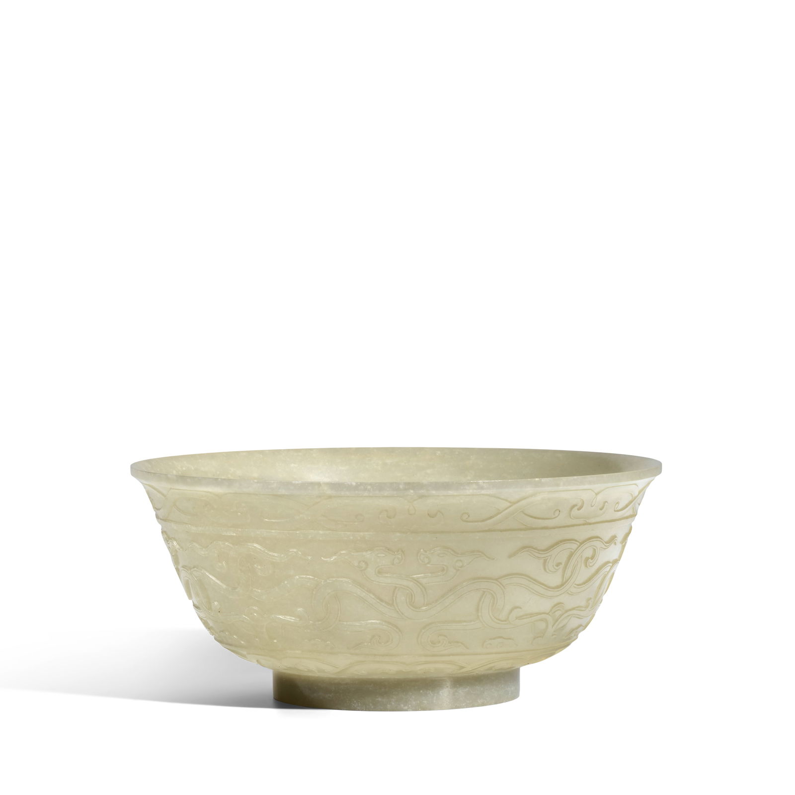 A CARVED WHITE JADE 'CHILONG' BOWL 18th century, four-character Qianlong Yuyong clerical script ...: A CARVED WHITE JADE 'CHILONG' BOWL 18th century, four-character Qianlong Yuyong clerical script mark Finely decorated with four pairs of entwined dragons on the center frieze, between a band of scroll