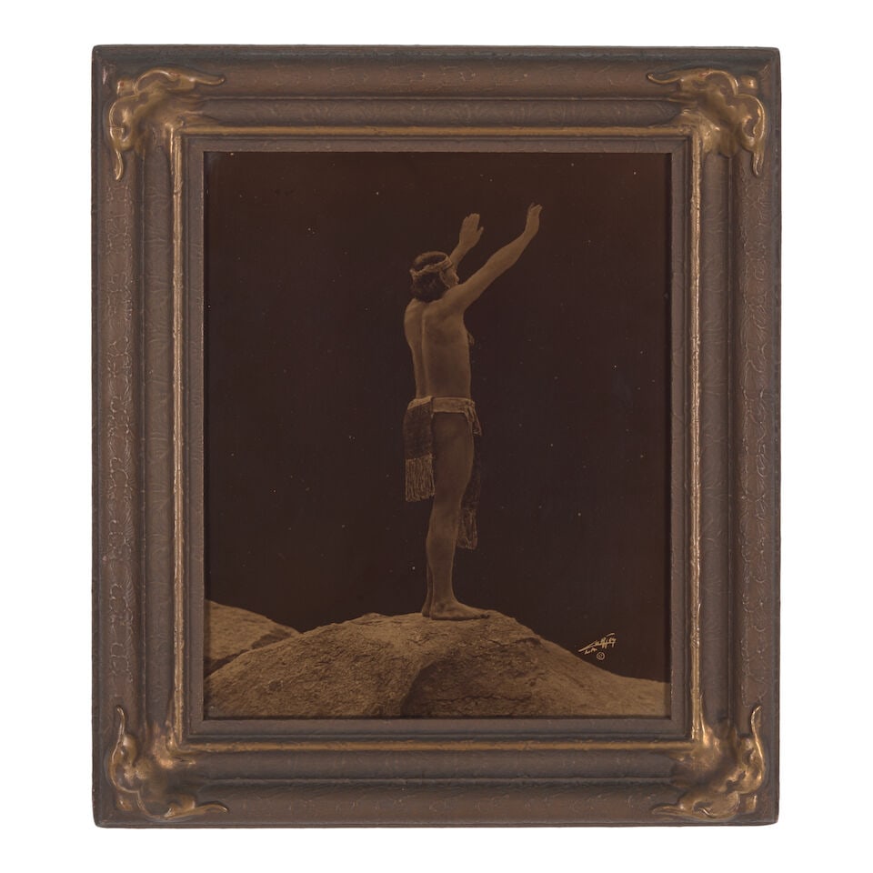 An Edward S. Curtis orotone, 'Prayer to the Stars': Edward S. Curtis American, (1868-1952), 'Prayer to the Stars,' orotone on glass in original Curtis Studio frame, signed, copyrighted and inscribed 'L.A.' for the Los Angeles Studio in the image lower