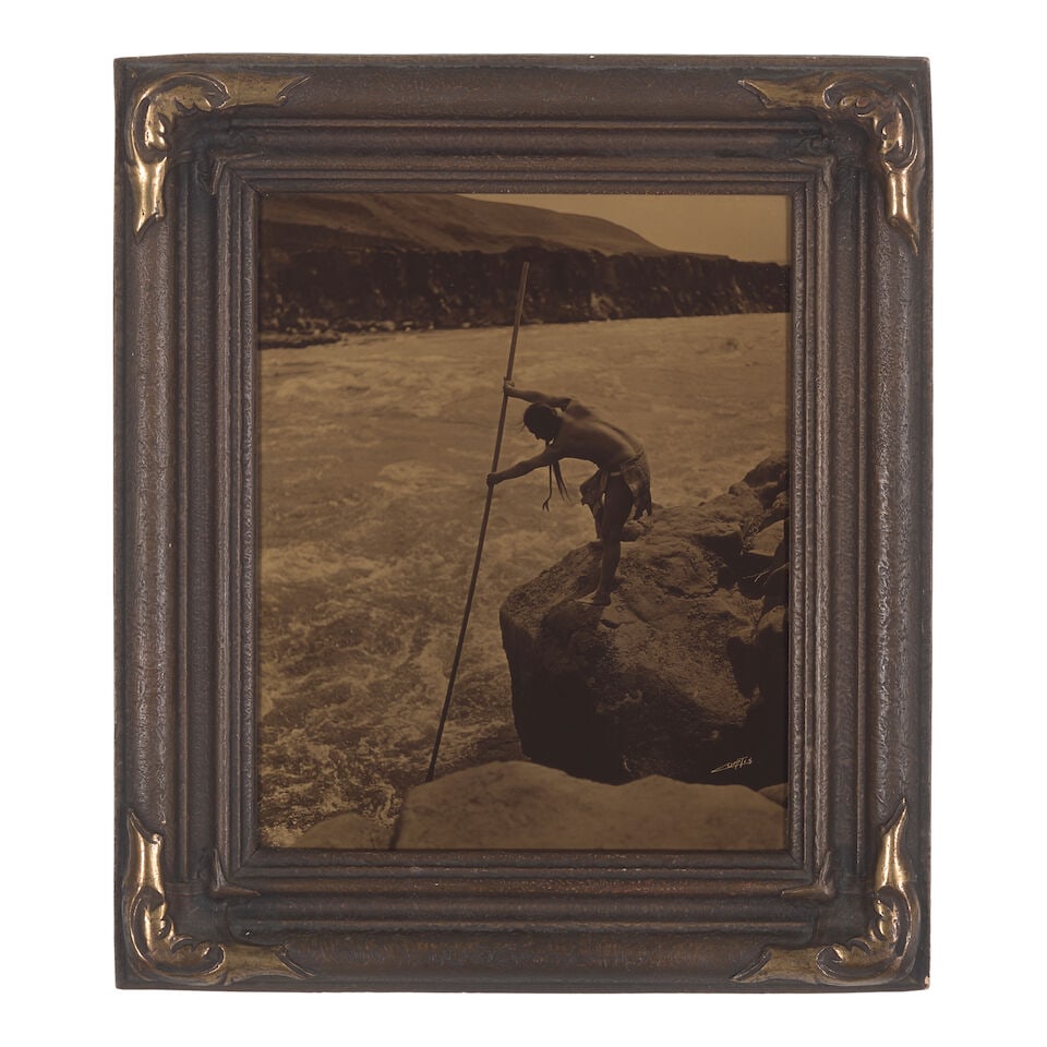 An Edward S. Curtis orotone, 'The Fisherman, Wisham': Edward S. Curtis American, (1868-1952), 'The Fisherman, Wisham,' orotone on glass in original Curtis Studio frame, signed in the image lower right. sight: height 9 5/8in, width 7 1/2in Footnotes: Prov