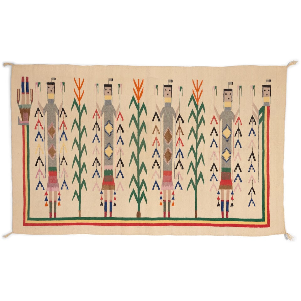 A Diné (Navajo) Shiprock Yei weaving: A Diné (Navajo) Shiprock Yei weaving Worked with four Yei figures alternating stalks of corn and enclosed overall by a Rainbow Yei figure, on a cream ground. size approximately 4ft 7 1/2in x 2ft