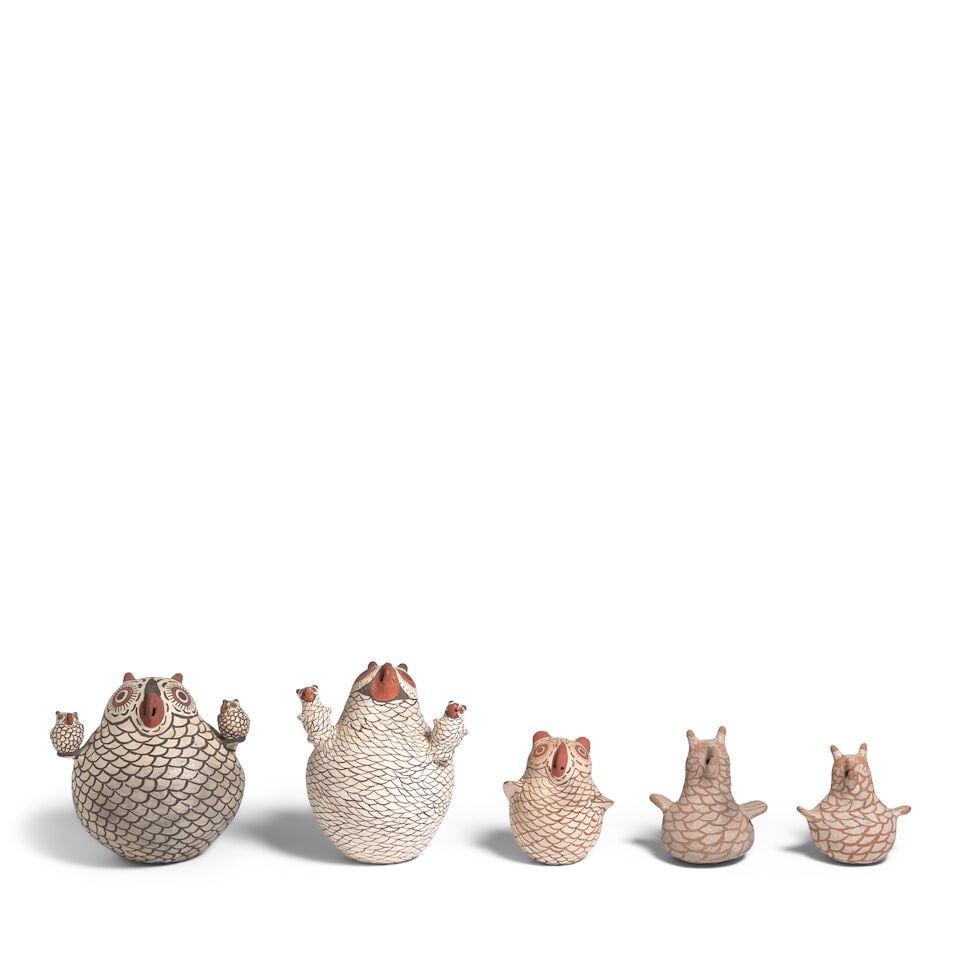 Five Zuni pottery owls: Five Zuni pottery owls Each of pottery and painted in cream, brown, red/orange, gray and/or taupe, the two largest examples each supporting a pair of babies on the wings, each apparently unsigned, the