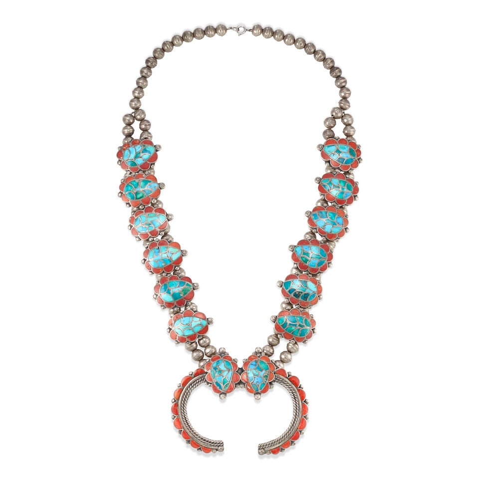 A Zuni multi-stone inlaid turtle-motif squash blossom-style necklace: A Zuni multi-stone inlaid turtle-motif squash blossom-style necklace Possibly the work of Lambert Homer, Sr. (Zuni, [1917-1972]), constructed with a single branching to a double strand of silver beads