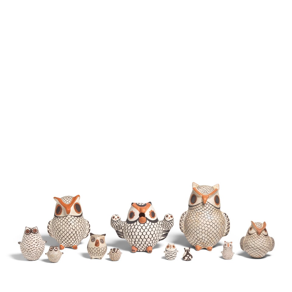 A collection of eleven Acoma pottery owls: A collection of eleven Acoma pottery owls Each pottery example painted in black, cream and orange and/or grey, two of the smallest in black and white only, the example with owlets signed: H. Antonio, 
