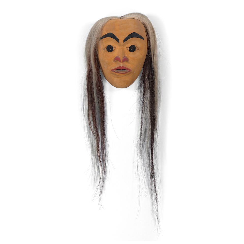 An Art Thompson mask, 1974: Art Thompson Nootka (Nuu-chah-nulth), (1948-2003), untitled, 1974, a carved and partially painted mask with applied horsehair, signed with artist's cypher and dated verso, inscribed in pencil: Carved