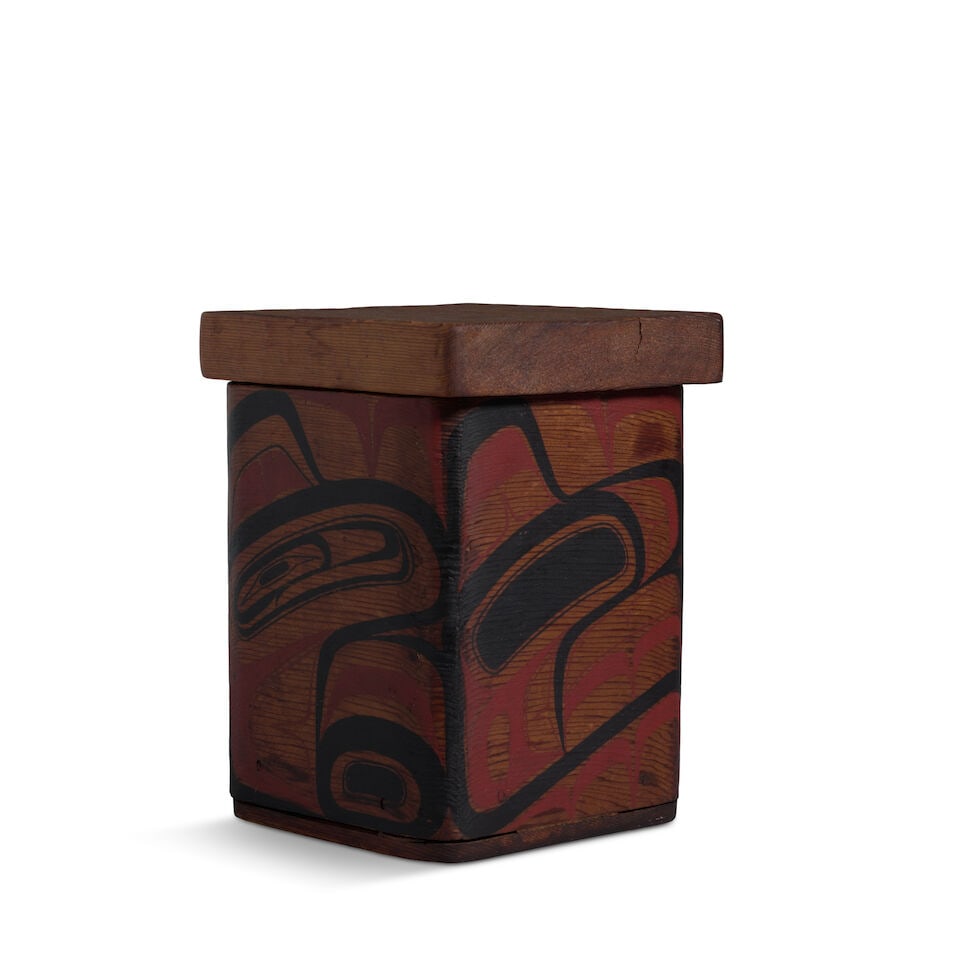 A Duane Pasco bentwood box: Duane Pasco Anglo/American, (1932-2024), a Haida-style carved and bentwood box, painted with red and black formline animal elements on each face, surmounted by a rectangular lid, signed on the