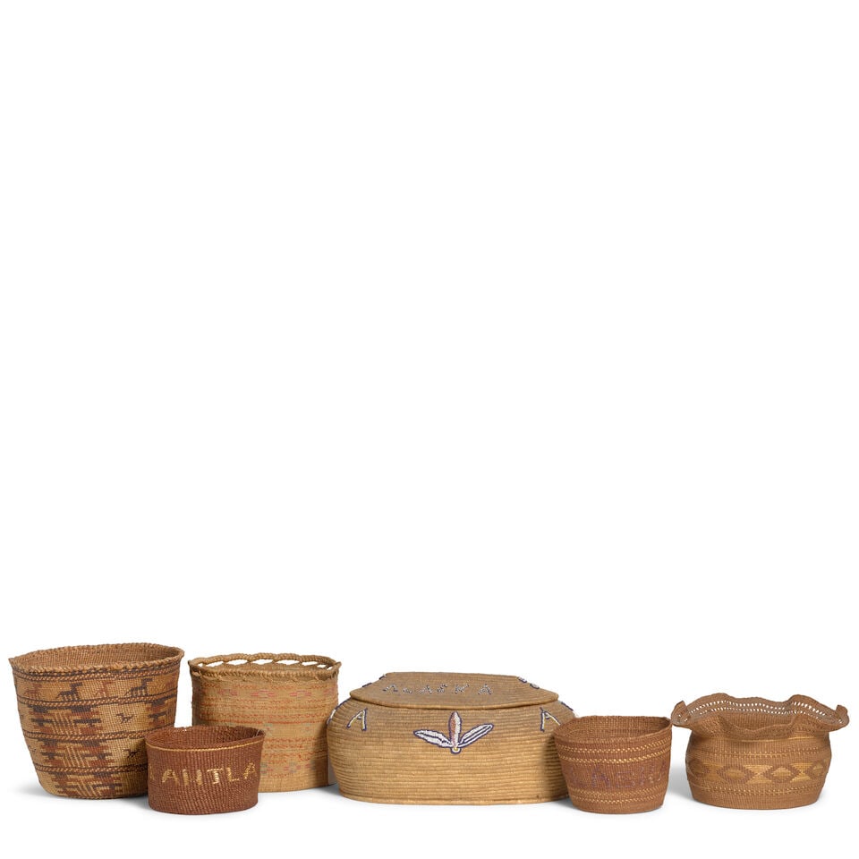 Six Northwest Coast or Inuit baskets: Six Northwest Coast or Inuit baskets Including a Tlingit basket with ruffle rim; an Inuit coiled lidded basket with beadwork spelling: 'Council City Alaska'; an Aleut basket with openwork rim; a