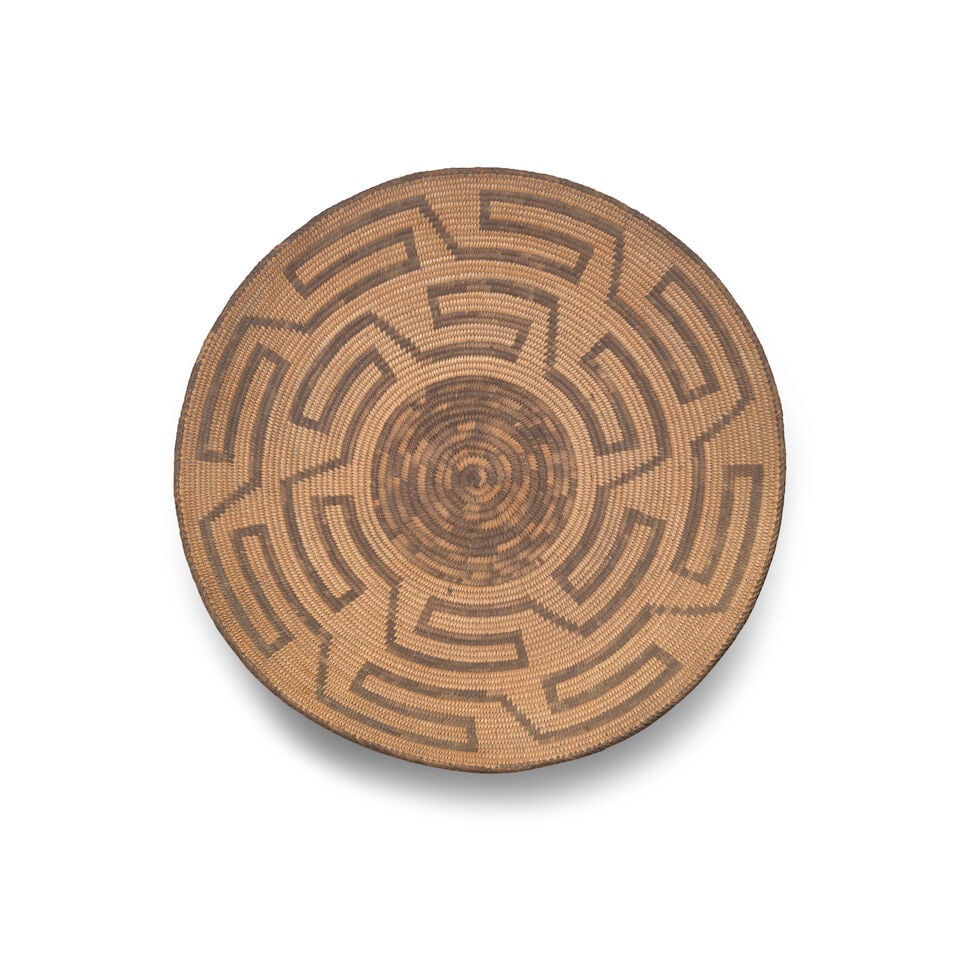 An Akimel O'odham (Pima) basketry tray: An Akimel O'odham (Pima) basketry tray With a pair of concentric fret bands below a braided rim. height 5 7/8in, diameter 19in For further information on this lot please visit Bonhams.com For further