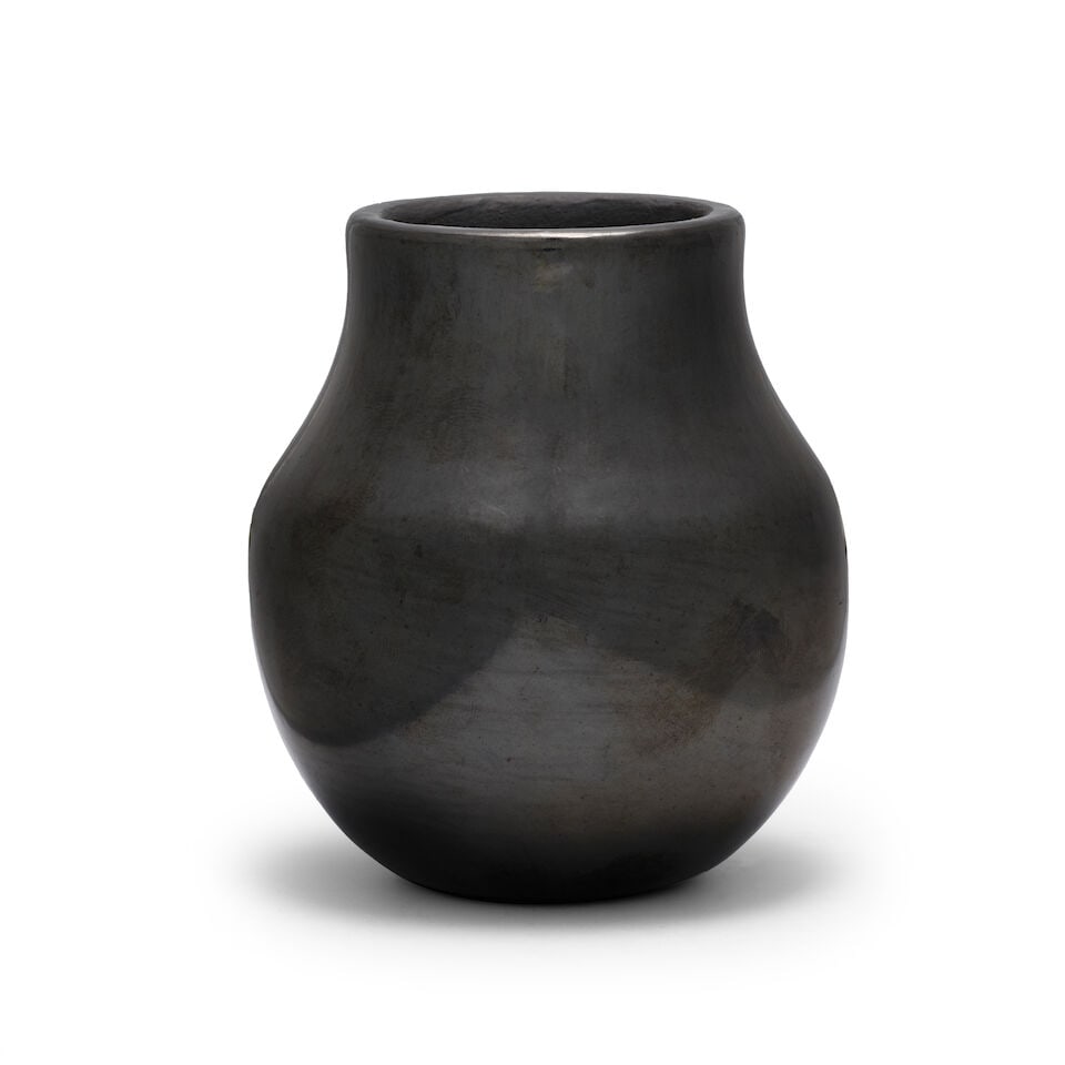 A Crucita Calabaza (Blue Corn) blackware pottery vase: Crucita Calabaza (Blue Corn) San Ildefonso Pueblo, (1921-1999), a petite polished blackware pottery vase, signed on the underside: Blue Corn / San Ildefonso Pueblo. height 3 7/8in, diameter 3