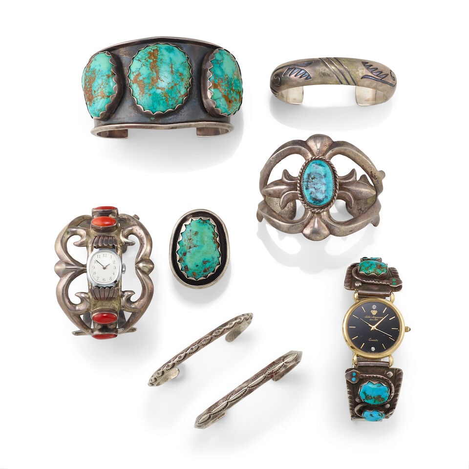 A collection of Southwest silver adornments: A collection of Southwest silver adornments Including: a cast openwork cuff set with a solitary turquoise, inscribed on the interior: TR-1; a wide cuff bracelet set with three turquoise (possibly