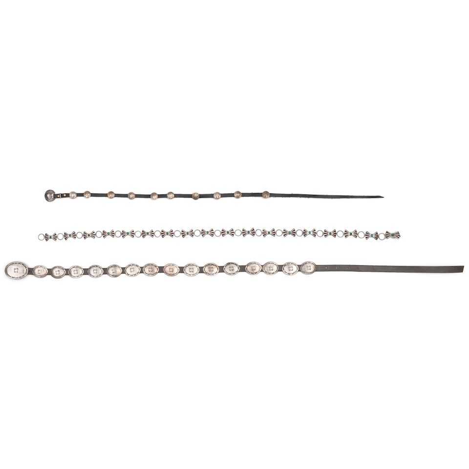 Three Southwest silver belts or hat bands: Three Southwest silver belts or hat bands Including a hat band with Liberty dime conchos and stamped buckle; a petite belt with fifteen stamped oval conchos and a conforming buckle, stamped: