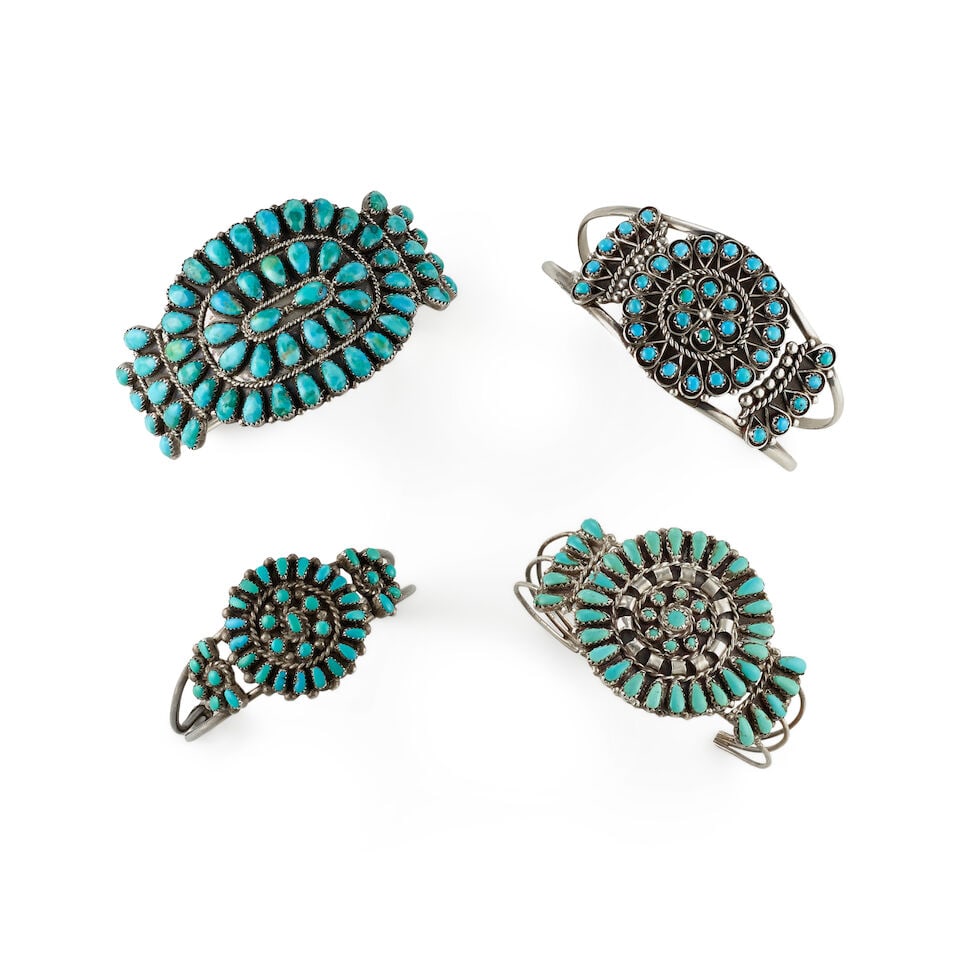 Four Diné (Navajo) or Zuni silver and turquoise cuff bracelets: Four Diné (Navajo) or Zuni silver and turquoise cuff bracelets Each of wire construction supporting plaques set with clusters of turquoise, comprising examples by Martin Byjoe (Zuni), Ophelia