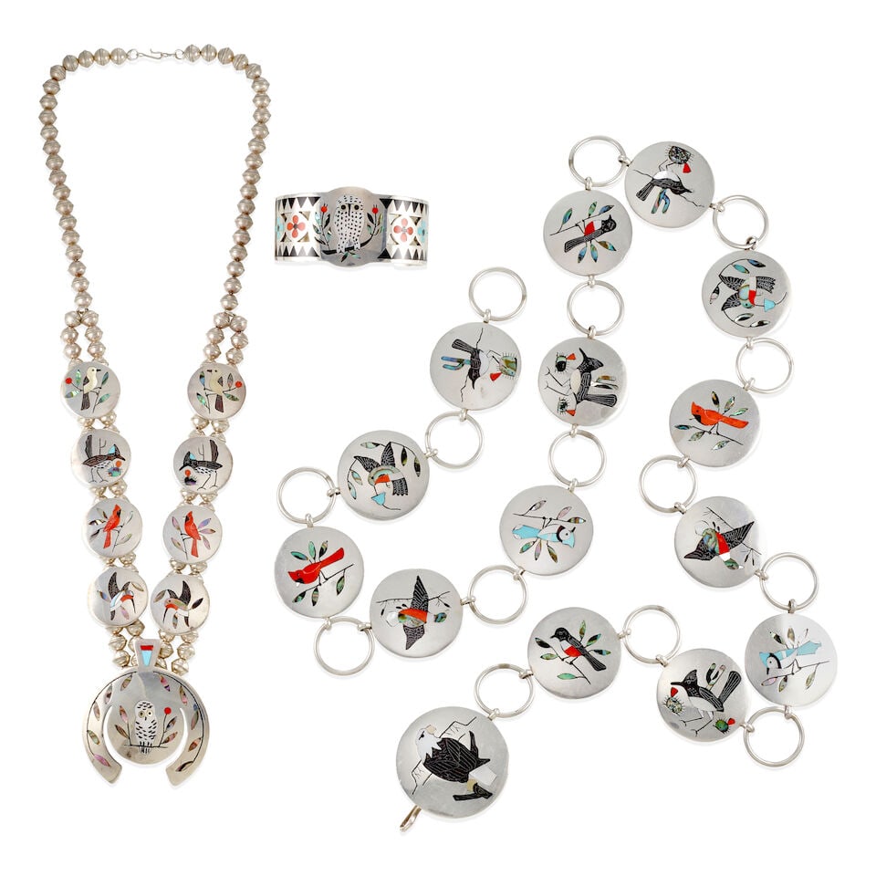 A collection of Edaakie Family avian themed jewelry items: necklace, bracelet and link belt: A collection of Edaakie Family avian themed jewelry items Zuni, (20th century), including a petite necklace, a mosaic owl on the naja, with conforming birds on the 8 plaques above, marked 'D