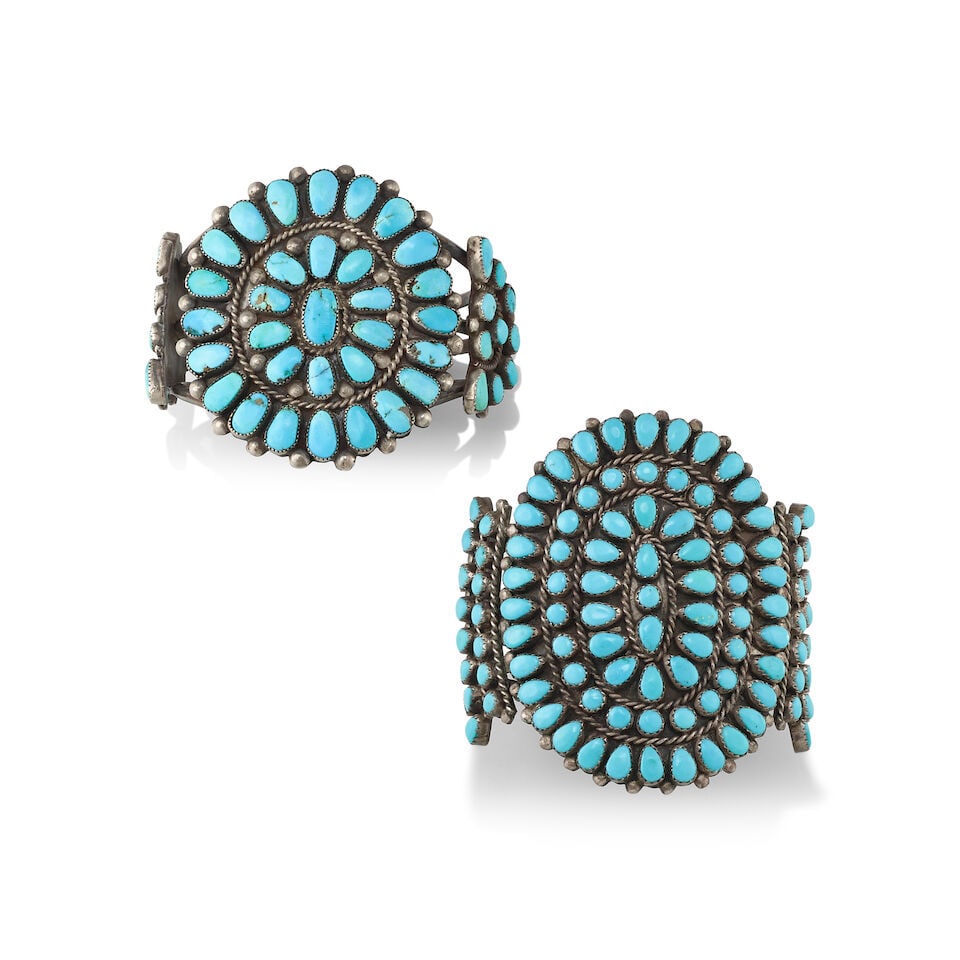 Two Zuni silver and turquoise cluster cuff bracelets: Two Zuni silver and turquoise cluster cuff bracelets Each constructed with three wires supporting clusters of rounded and teardrop-shaped turquoise stones. first (larger): inner circumference