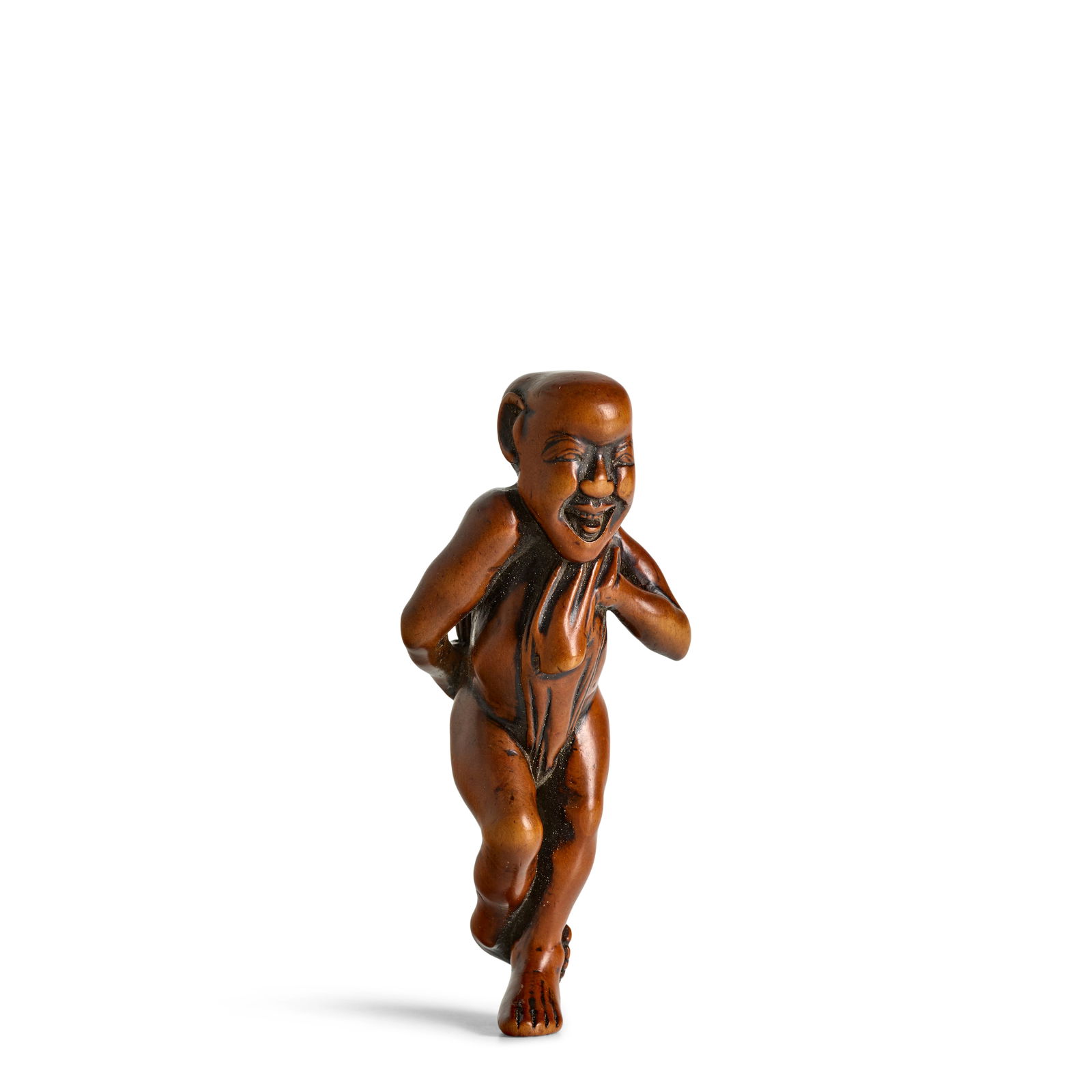 A LARGE WOOD NETSUKE OF A MAN TYING HIS FUNDOSHI (LOIN CLOTH) Edo period (1615-1868), 18th/19th ...: A LARGE WOOD NETSUKE OF A MAN TYING HIS FUNDOSHI (LOIN CLOTH) Edo period (1615-1868), 18th/19th century Carved as a bald-headed man standing on one foot with the other hooked around his ankle as he st